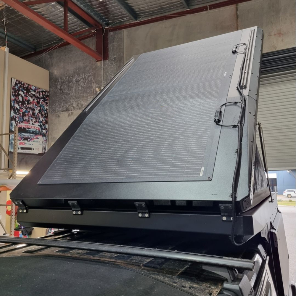 Rooftop tent with custom flexible solar panels